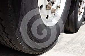 Wheel of large truck and trailers in the street