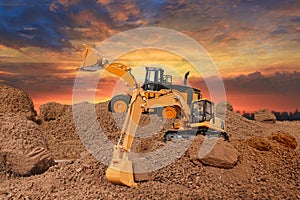 Wheel loader and Crawler excavator are digging the soil