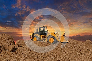 Wheel loader are digging the soil in construction site