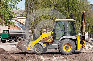 Wheel loader Excavator with back hoe loading sand