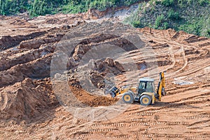 Wheel loader excavator machine working in construction site. wheel loader at sandpit during earthmoving works