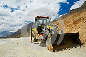 Wheel loader excavator at mountains work