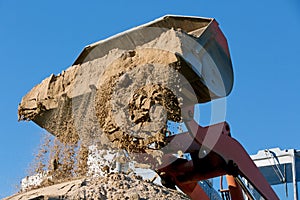 Wheel loader Excavator unloading sand