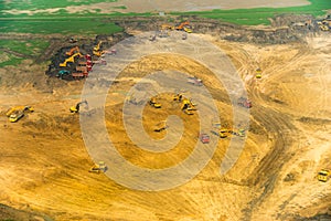 Wheel loader Excavator unloading sand, tractors and dump truck i