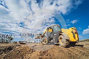 Wheel loader excavator works at construction site