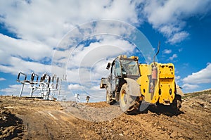 Wheel loader excavator works at construction site