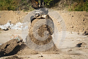 Wheel loader excavator works at construction site