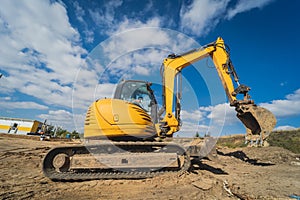 Wheel loader excavator works at construction site