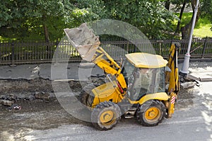 Wheel loader machine on the road.