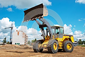 Wheel loader at sandpit during earthmoving works