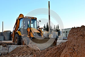 Wheel loader tractor bulldozer in sandpit.