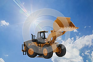 Wheel loaders on  a  sunlight background