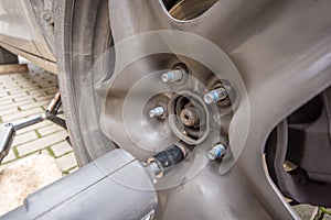 The wheel nuts are loosened with a torque wrench when changing tires