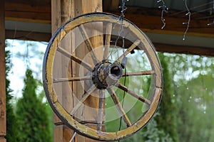 Wheel of the past. An ancient old wooden wheel from a rural cart