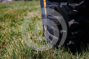 Wheel of quad bike atv on the grass