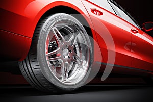 Wheel of red sports car closeup in studio lighting 3d