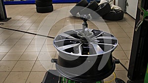 Wheel Rim On Balanced Stand In A Car Workshop