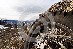 Wheel with spokes and brake disc plus Enduro motorcycle chain.