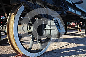 Wheel with spokes old railway car close to