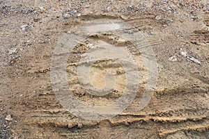 Wheel track on dirt soil texture