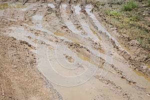 Wheel track on dirt soil texture after rainning