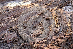 Wheel track on wet soil or mud