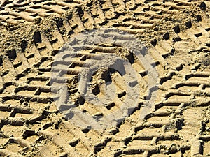 Wheel tracks on country road sand