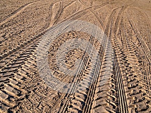 Wheel tracks on country road sand