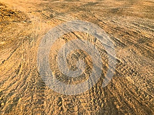 Wheel tracks dirt on country road