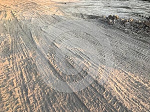 Wheel tracks dirt on country road