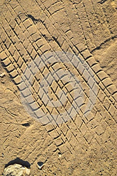 Wheel tracks on sand ground texture