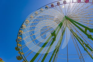 Wheel in the wheel. A round rainbow around the Ferris wheel.