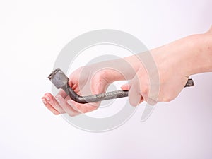 Wheel wrench in hand of the girl. Symbol of hard work, feminism and labor day. Isolate on white background