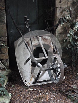 Wheelbarrow damaged and abandoned