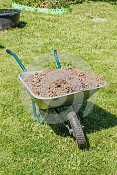 Wheelbarrow with dirt