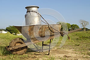 Wheelbarrow and milk churn