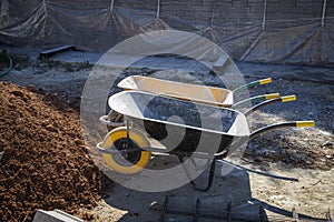 Wheelbarrows ready to load the earth photo