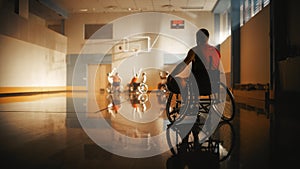 Wheelchair Basketball Game: Player Wearing Red Shirt Holding Ball Waiting for His Turn. Athlete Wa