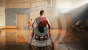 Wheelchair Basketball Game: Professional Player Prepairing to Play. He is Ready to Compete, Dribbl