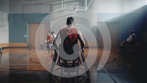 Wheelchair Basketball Game: Professional Player Prepairing to Play. He is Ready to Compete, Dribbl