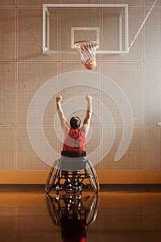 Wheelchair Basketball Play: Player Shooting Ball Successfully, Scoring a Perfect Goal, Celebrating
