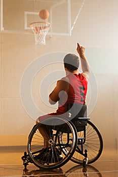 Wheelchair Basketball Play: Player Shooting Ball Successfully, Scoring a Perfect Goal. Skill of a