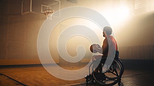 Wheelchair Basketball Player Wearing Red Uniform Holding Ball, Prepairing to Score a Perfect Goal.