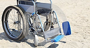 Wheelchair on the beach in summer