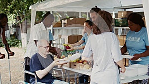 Wheelchair-bound man receives food