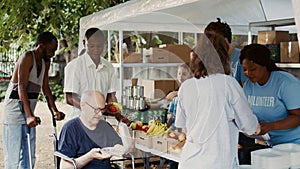 Wheelchair-bound man receives food