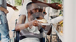 Wheelchair-bound man receives free food