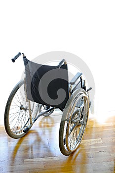 Wheelchair for disabled people on the bedroom in front of the wi