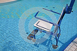 Wheelchair for the disabled in swimming pool