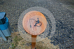 Wheelchair fishing area on lake shore in public park
